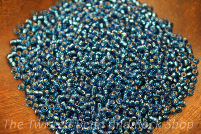 11/0 Silver Lined Round Deep Aqua Seed Beads