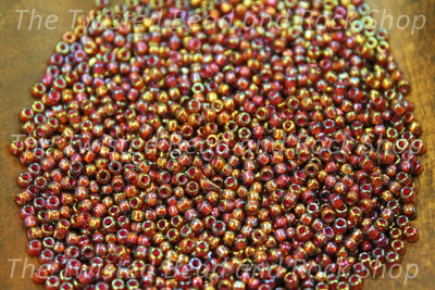 11/0 Fancy Amber Cranberry Seed Beads